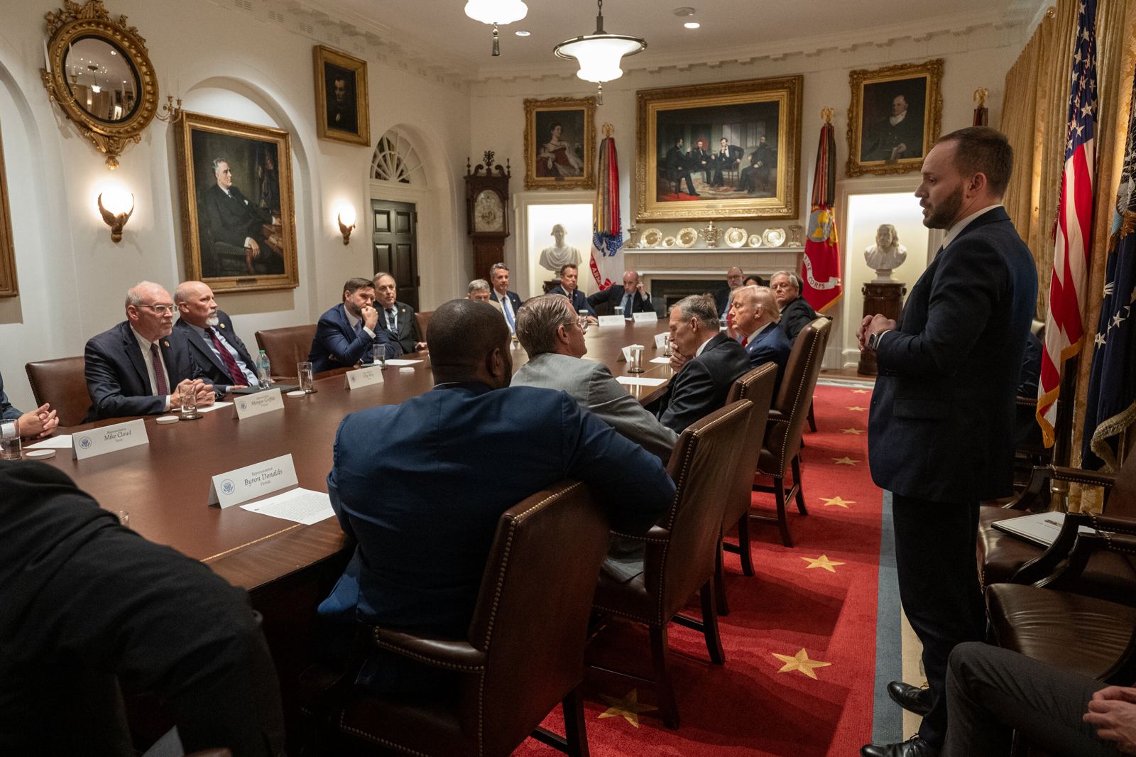 Jay Fields standing and briefing the President and members of Congress at the Cabinet Room table in the White House.